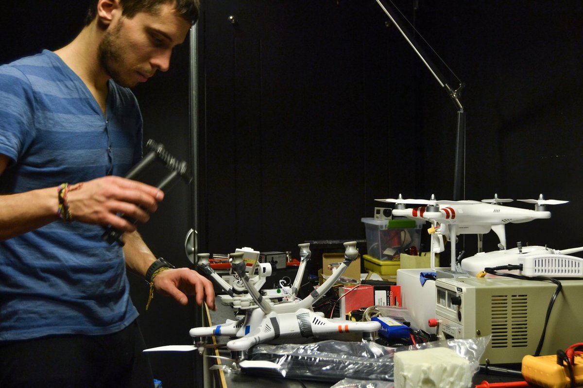 Drone prep at the DTU lab: the two platforms used in the study, the $500 quadcopter (right) and the heavier hexacopter (left). Both were off-the-shelf consumer hardware.